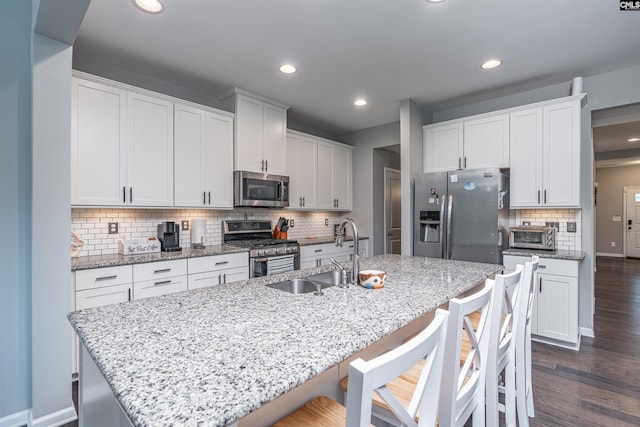 742 Westfield Rd, Lexington, SC 29073 - kitchen featuring recessed lighting, white cabinets, tasteful backsplash, a sink, and stainless steel appliances