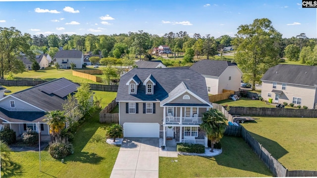 birds eye view of property with a residential view