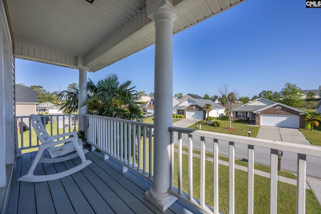 deck featuring a residential view and a porch