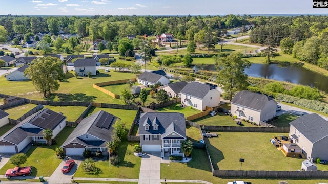 bird's eye view with a water view and a residential view