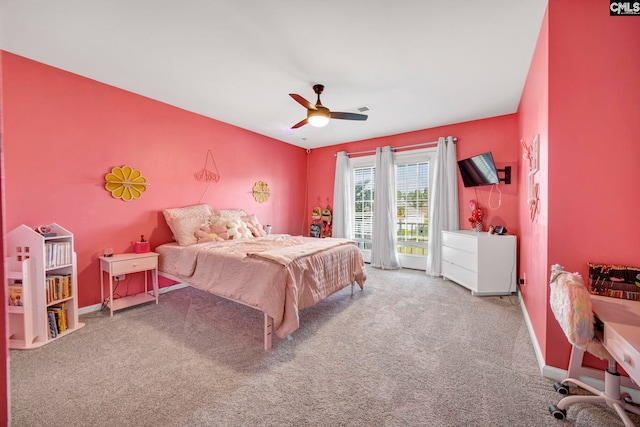 carpeted bedroom with baseboards, visible vents, and ceiling fan