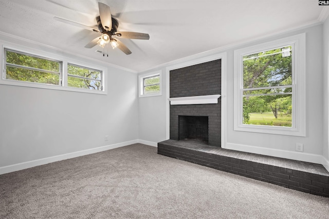 unfurnished living room featuring crown molding, a ceiling fan, baseboards, and carpet floors