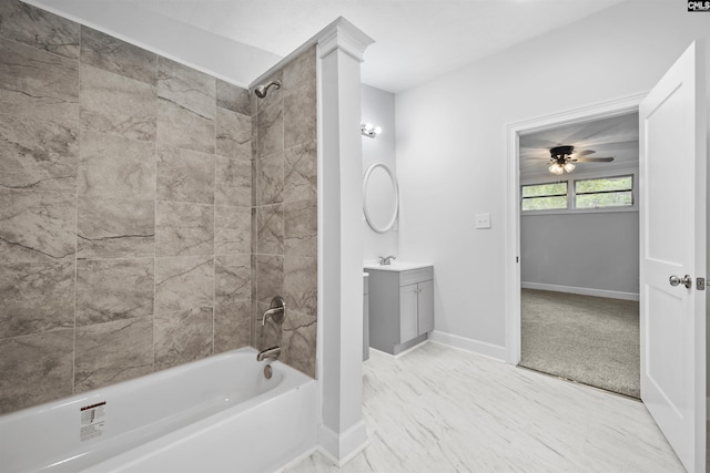 full bathroom featuring vanity, a ceiling fan, baseboards, and bathtub / shower combination