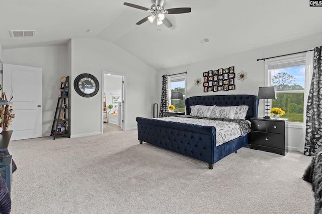 bedroom with carpet flooring, baseboards, visible vents, and lofted ceiling