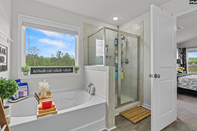 ensuite bathroom with ensuite bathroom, a stall shower, recessed lighting, and a garden tub