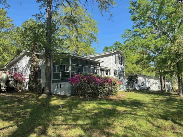 829 Rocky Point Cir, Ridgeway, SC 29130 - view of side of property with a sunroom, a lawn, and a chimney