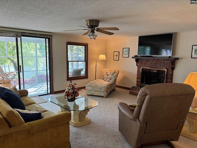 829 Rocky Point Cir, Ridgeway, SC 29130 - living room with carpet flooring, a textured ceiling, a ceiling fan, and a fireplace