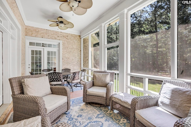 sunroom / solarium with french doors and ceiling fan