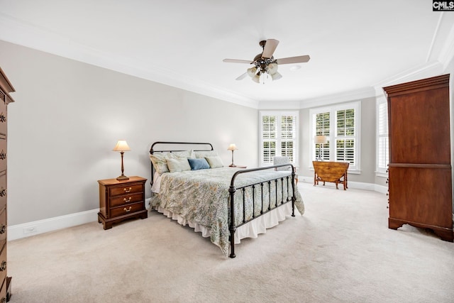 bedroom with crown molding, a ceiling fan, baseboards, and light carpet