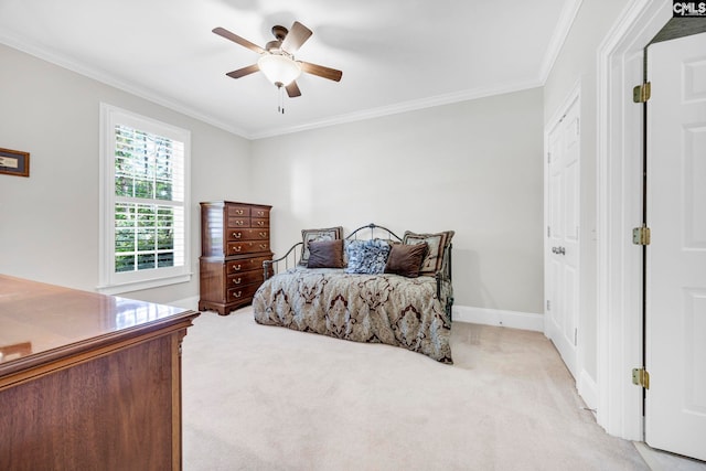 bedroom featuring a ceiling fan, baseboards, light colored carpet, and ornamental molding