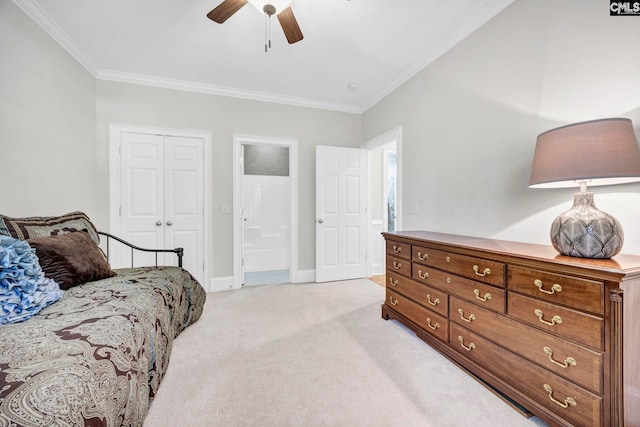 bedroom featuring a ceiling fan, light colored carpet, crown molding, baseboards, and a closet