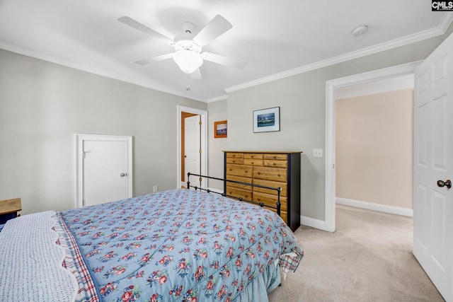 bedroom with light colored carpet, baseboards, crown molding, and ceiling fan