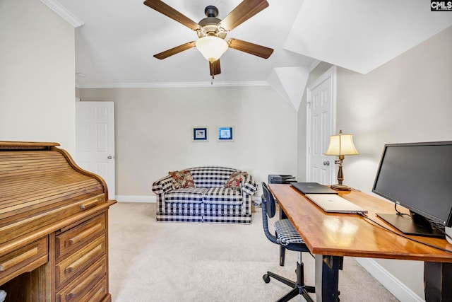 carpeted home office with crown molding, a ceiling fan, and baseboards