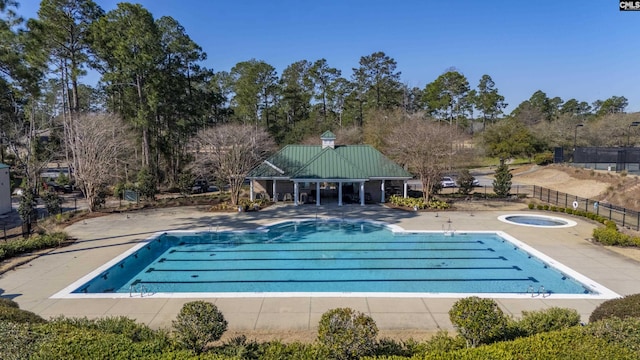 pool featuring a patio and fence