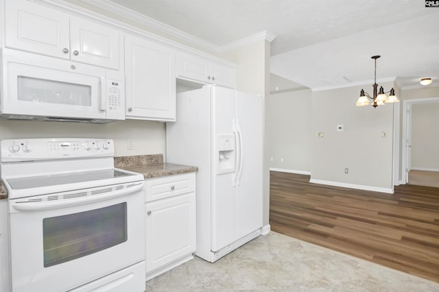 kitchen featuring crown molding, white cabinets, white appliances, and a notable chandelier