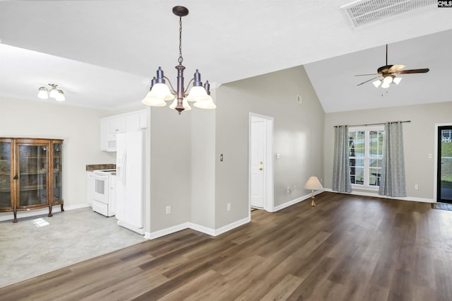 unfurnished dining area with visible vents, wood finished floors, baseboards, high vaulted ceiling, and ceiling fan with notable chandelier