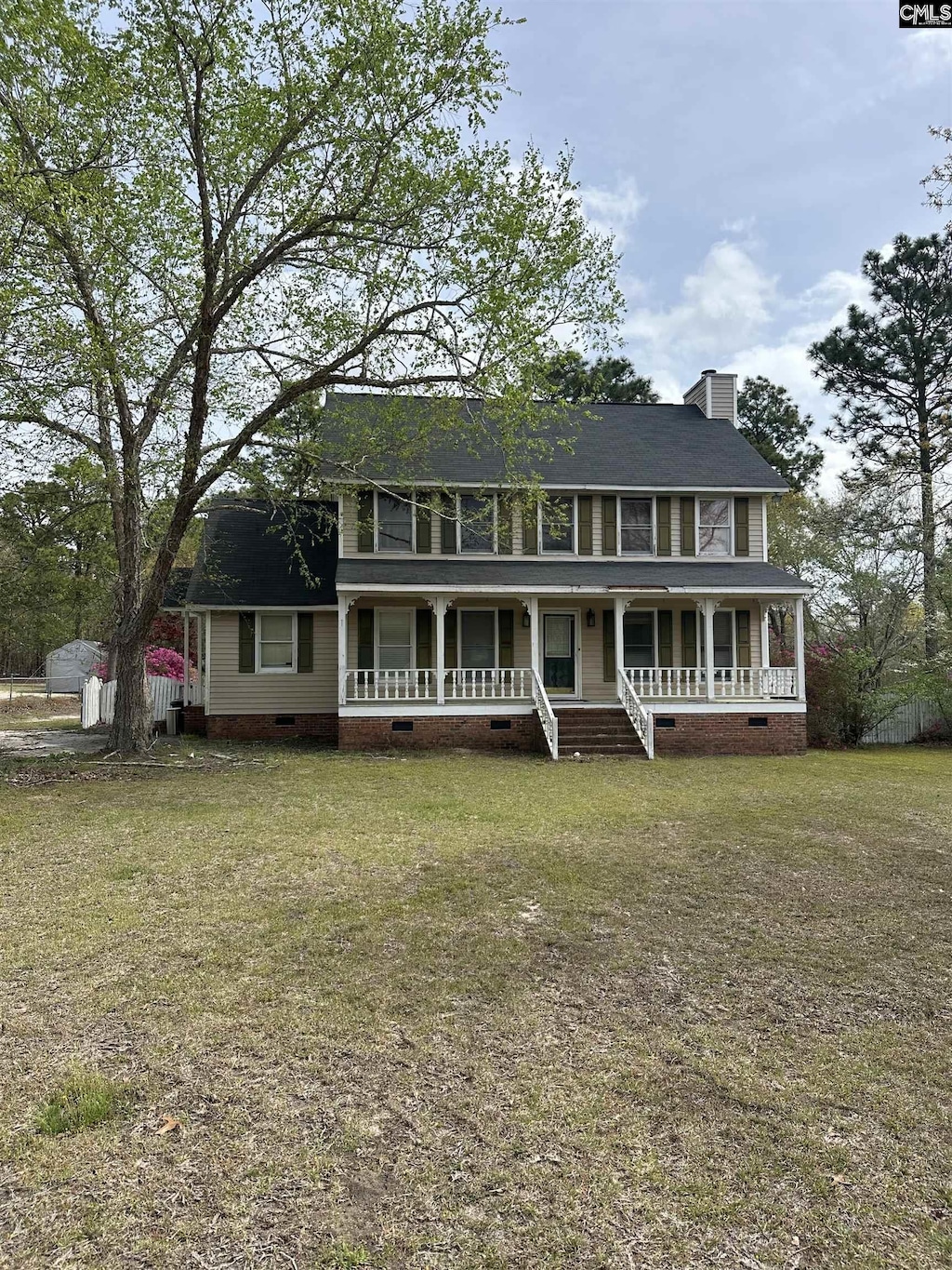 4866 Misty Pine Ln, Orangeburg, SC 29118 - colonial-style house with a porch, a front lawn, a chimney, and crawl space