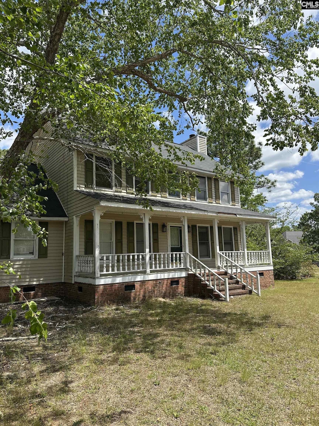 4866 Misty Pine Ln, Orangeburg, SC 29118 - view of front of home with covered porch, a front yard, and crawl space
