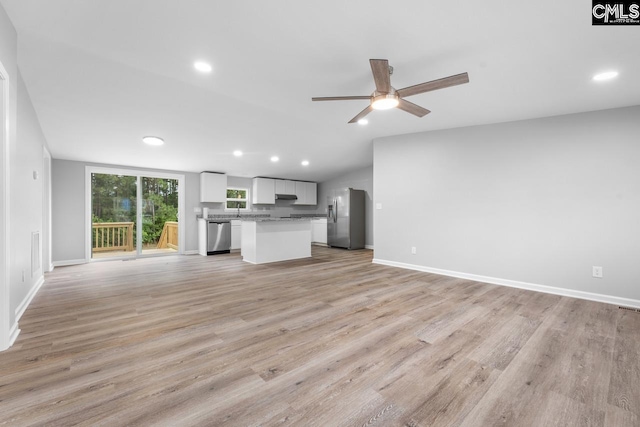 unfurnished living room featuring recessed lighting, a ceiling fan, and light wood finished floors