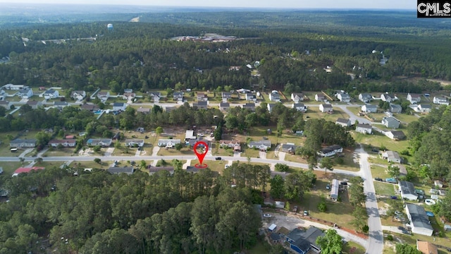 aerial view with a residential view and a wooded view