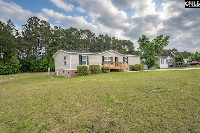 manufactured / mobile home featuring a front yard, crawl space, and a deck