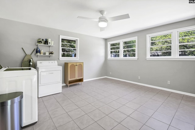 clothes washing area featuring laundry area, a ceiling fan, baseboards, and light tile patterned floors