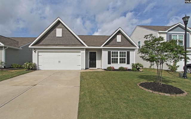 ranch-style house with an attached garage, a front lawn, and driveway