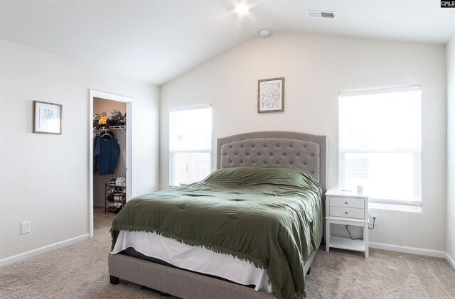 713 Sapodilla Ln, Gilbert, SC 29054 - bedroom featuring a walk in closet, carpet, vaulted ceiling, and visible vents