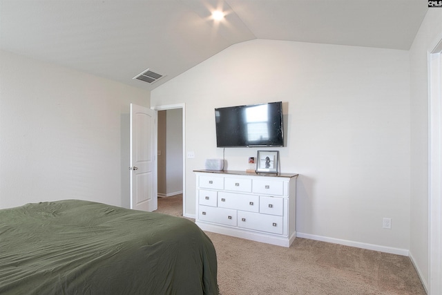 bedroom featuring baseboards, visible vents, light carpet, and vaulted ceiling