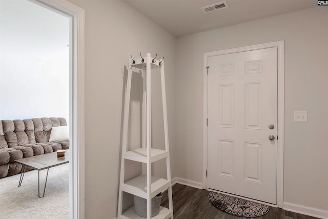 mudroom with baseboards, visible vents, and dark wood-style floors