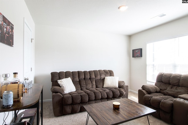 living room with light colored carpet and baseboards