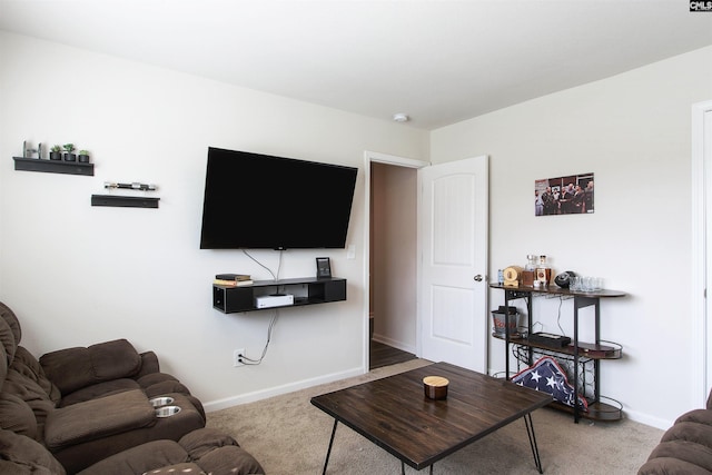 living area with baseboards and carpet flooring