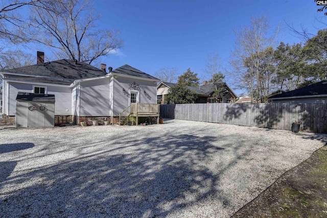 view of yard featuring fence and a wooden deck