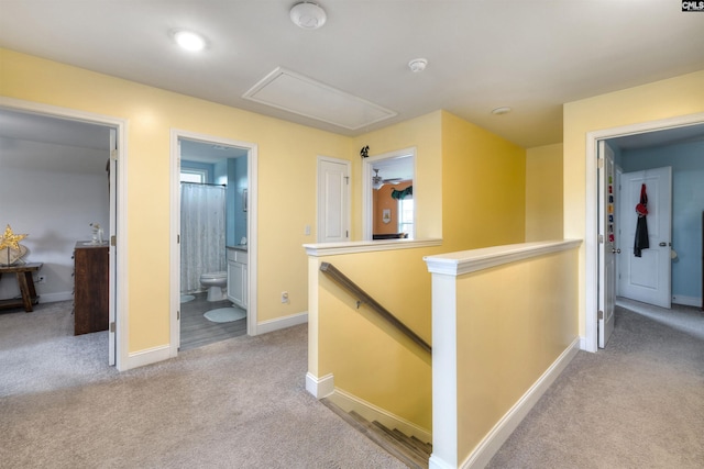 535 Kittiwake Ln, Sumter, SC 29150 - corridor featuring baseboards, attic access, carpet flooring, and an upstairs landing