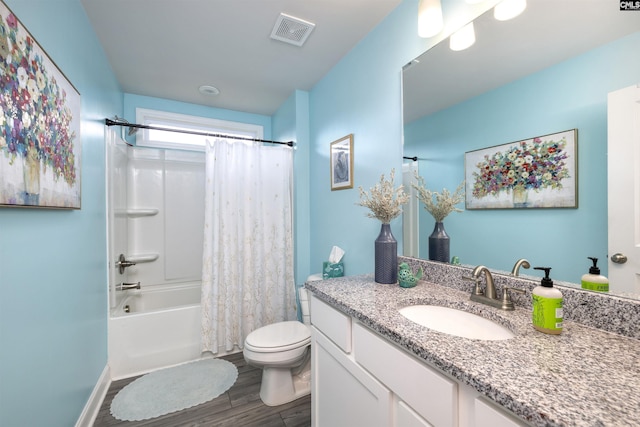 full bath featuring visible vents, wood finished floors, vanity, toilet, and shower / bathtub combination with curtain