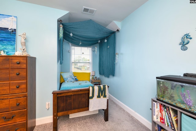 interior space with carpet floors, baseboards, and visible vents