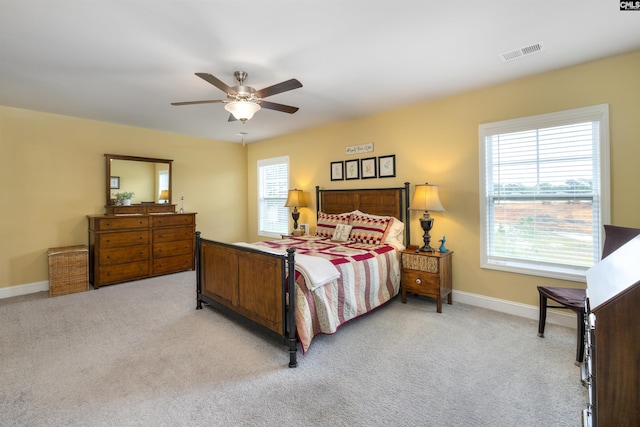 535 Kittiwake Ln, Sumter, SC 29150 - bedroom with a ceiling fan, baseboards, light colored carpet, and visible vents