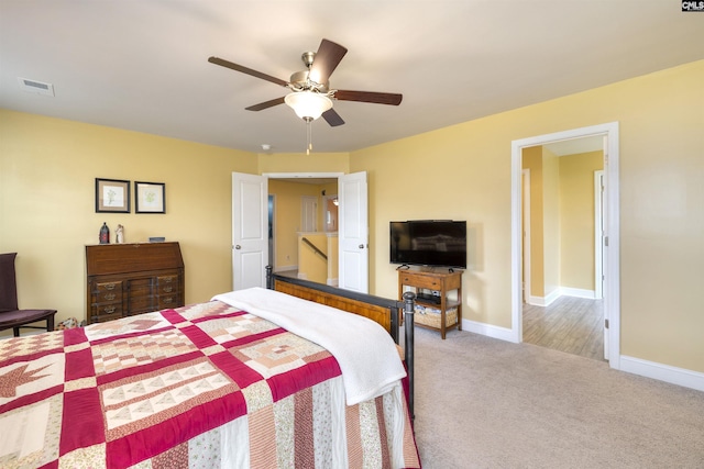 bedroom featuring a ceiling fan, baseboards, and carpet