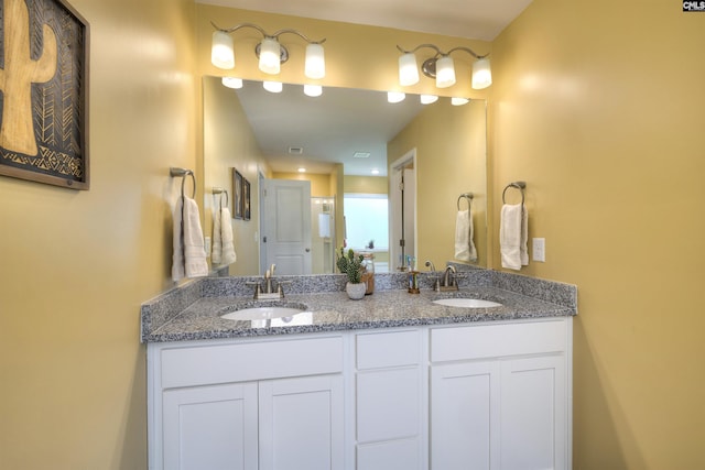 full bath featuring a sink and double vanity