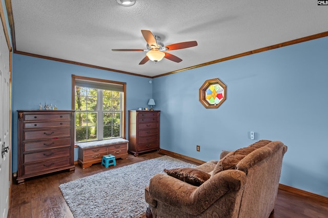 interior space with crown molding, dark wood-style flooring, ceiling fan, a textured ceiling, and baseboards