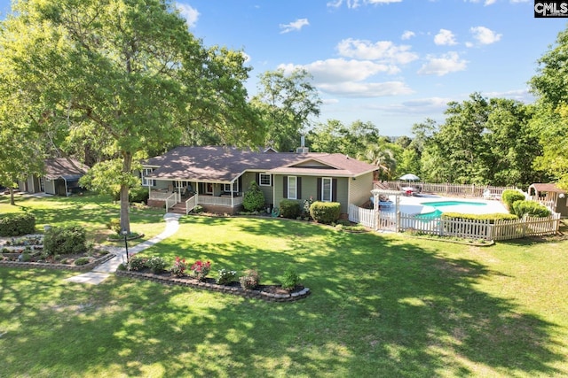 view of front facade featuring covered porch, a fenced in pool, a fenced backyard, and a front yard