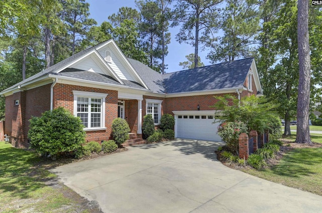 view of front of house with concrete driveway, brick siding, an attached garage, and a shingled roof