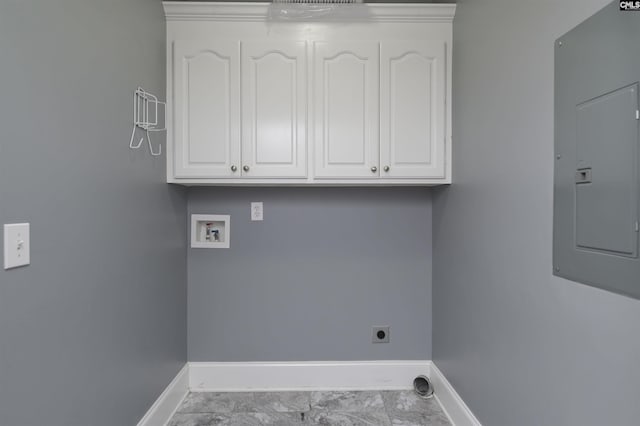 laundry area featuring baseboards, hookup for a washing machine, electric panel, and hookup for an electric dryer