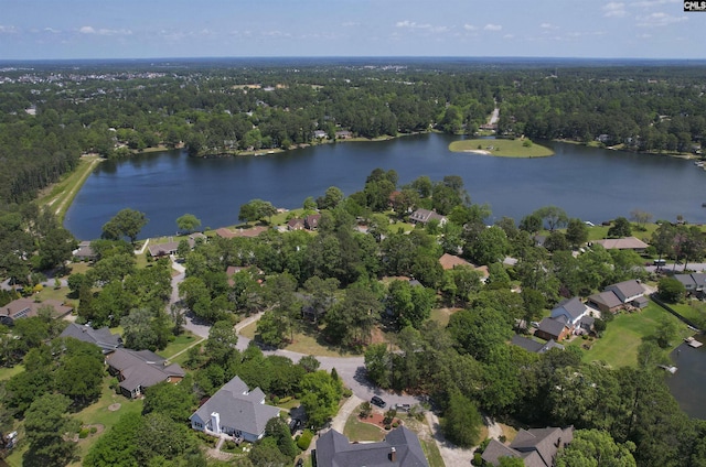 aerial view featuring a water view, a residential view, and a wooded view