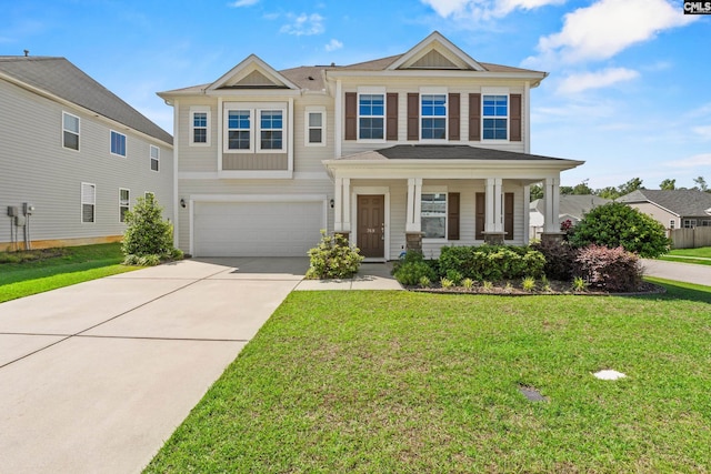 craftsman-style home with an attached garage, driveway, and a front lawn