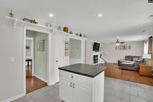 kitchen featuring light tile patterned floors, dark countertops, ceiling fan, and recessed lighting