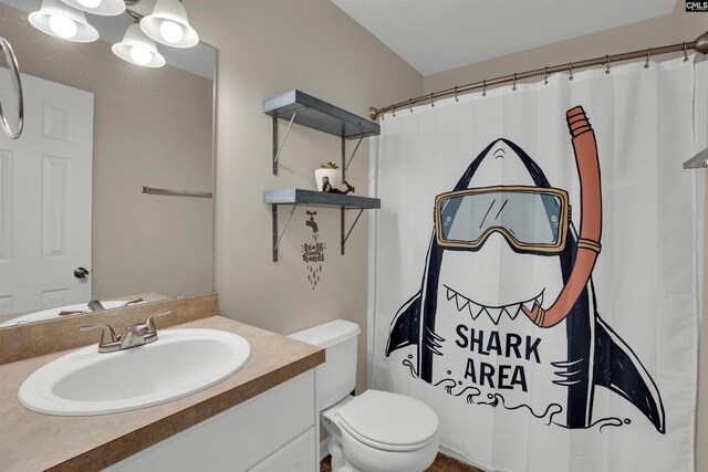 full bathroom with toilet, a shower with shower curtain, and vanity