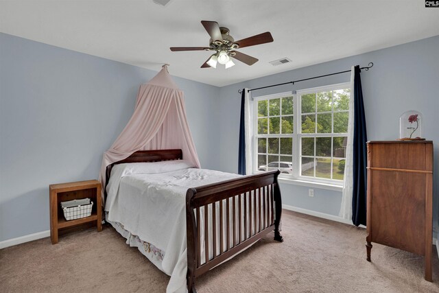 bedroom featuring carpet floors, baseboards, ceiling fan, and visible vents