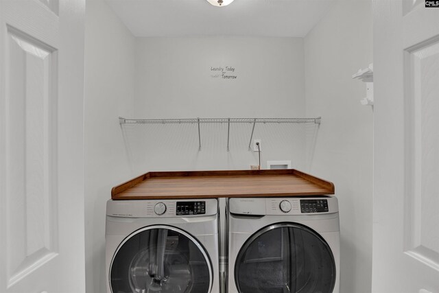 clothes washing area featuring laundry area and independent washer and dryer