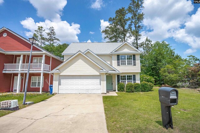 view of front of property featuring an attached garage, a front yard, and concrete driveway
